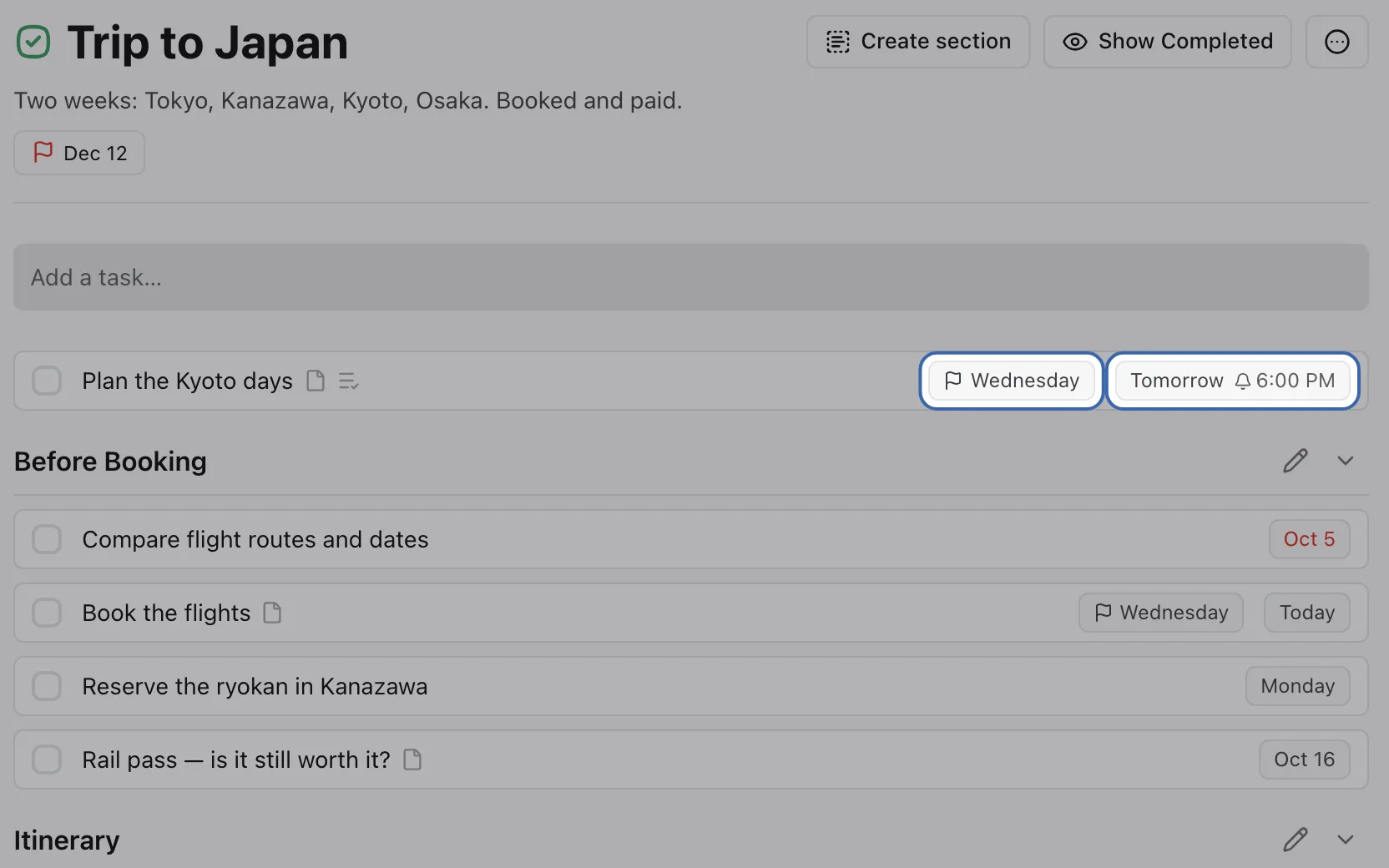 A task row in the Trip to Japan project with two chips highlighted: a flag for its deadline on Wednesday, and its start date, tomorrow, with a 6:00 PM reminder.